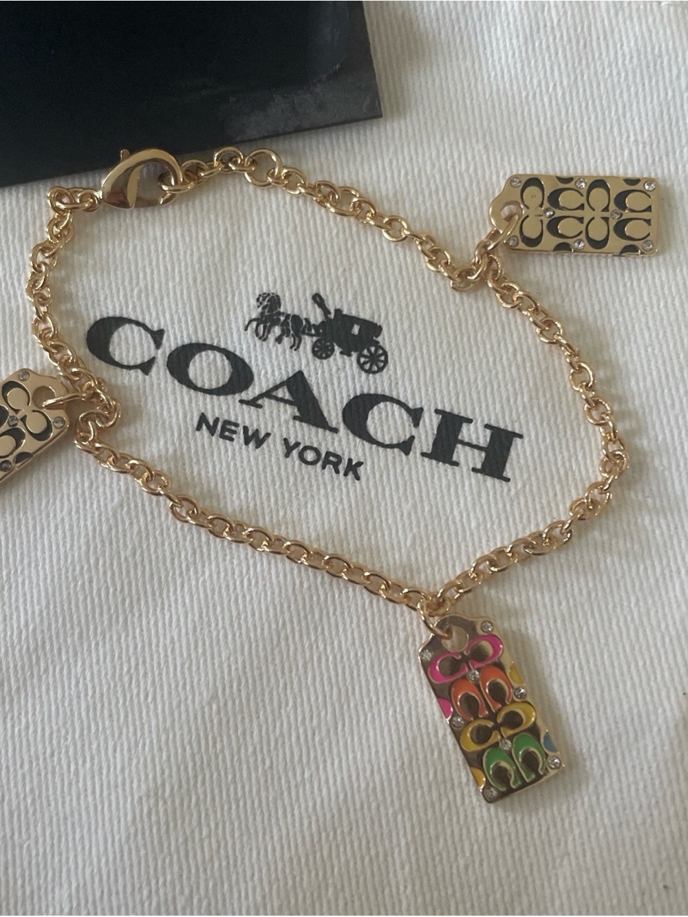 Coach Gold-Tone Chain Bracelet with Multicolor Enamel Coach Tags